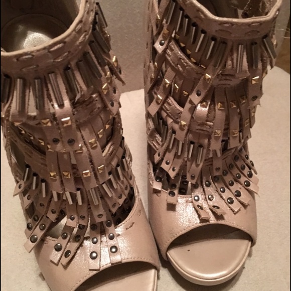 Nude fringe heels.