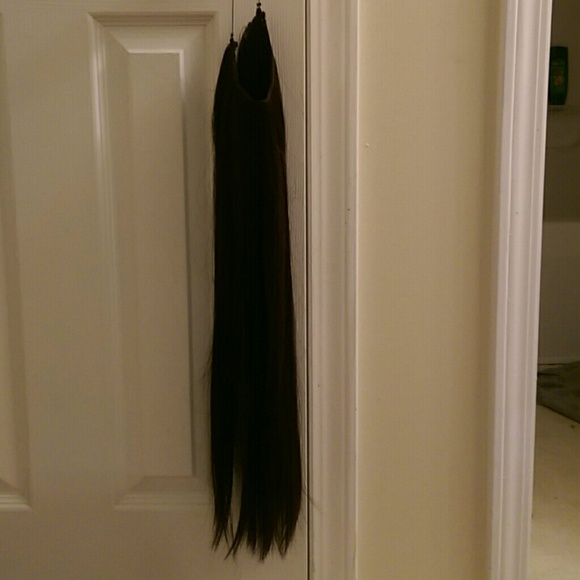 Dark brown secret hair extensions.
