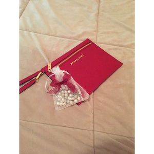 Michael Kors clutch, brand new.