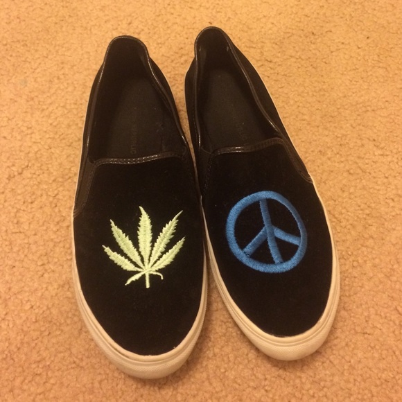 Black slip ons, worn but good condition.