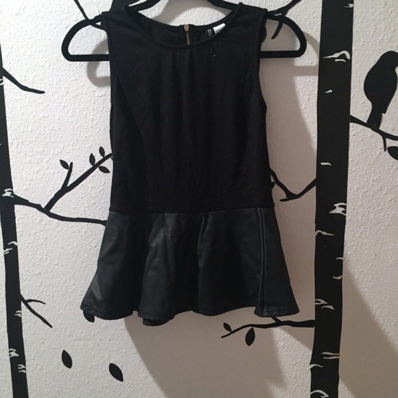 Peplum black sleeveless top