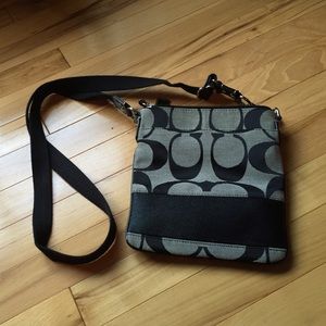 Coach side bag. Never used.  Took tags off.