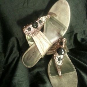Bejeweled pewter thong-style sandal heels.
