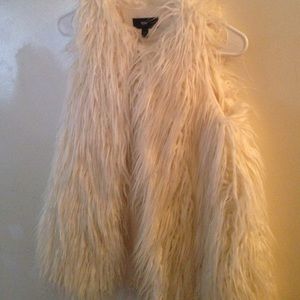 White fur vest