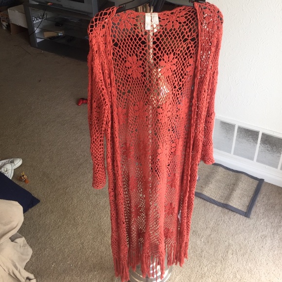Floral knit cover, rust colored