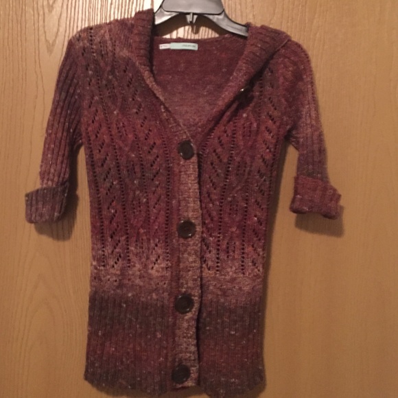 Quarter sleeve button up sweater.