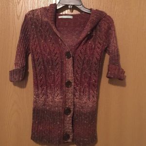 Quarter sleeve button up sweater.