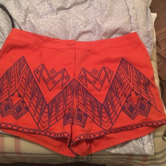 Shorts, with purple Aztec print.