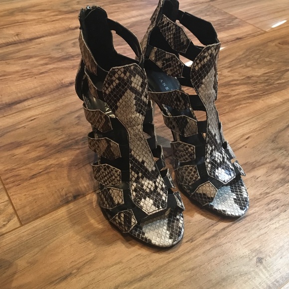 Used high heel sandals. Snake skin pattern