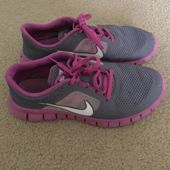 Purple and grey Nike free runs