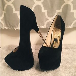 Black and gold pumps