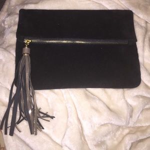 Black velvet clutch with gold and black tassels