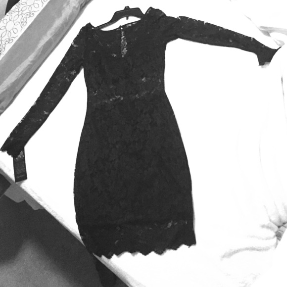 Beautiful black lace cocktail dress .