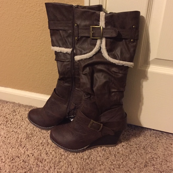Brown wedge boots.
