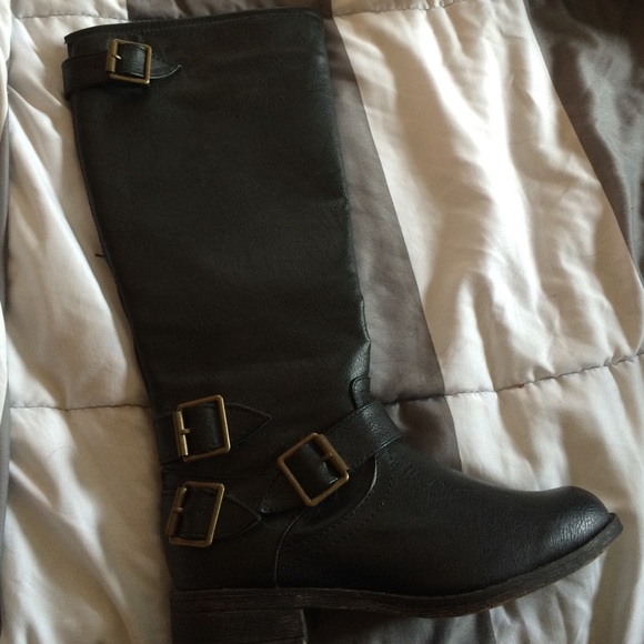 Black knee high boots. Never worn.