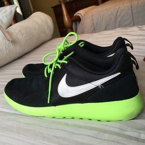 Green and black nike roshe