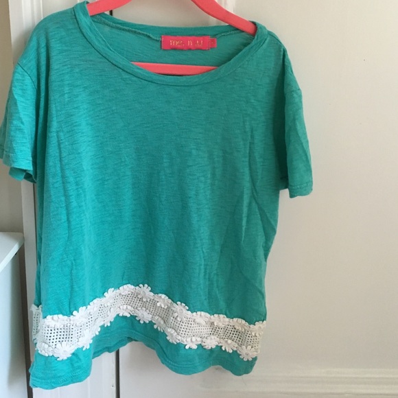 Girls turquoise crop top with daisy hem