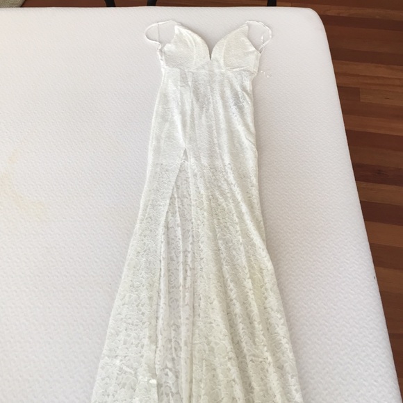 white summer dress with a deeper plunge in front