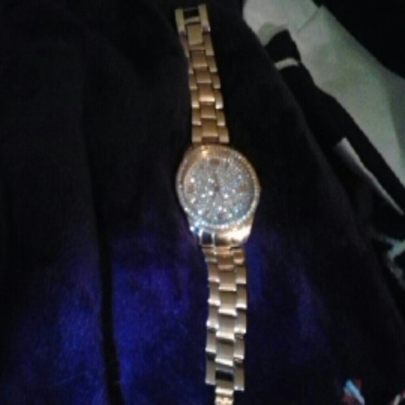 Beautiful rose golds tone watch with bling.