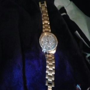 Beautiful rose golds tone watch with bling.