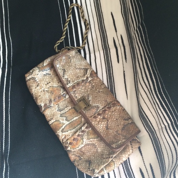 Faux snakeskin clutch.