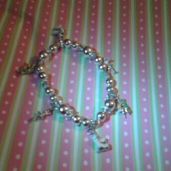 Silver tone  bracelet with figure skating charms