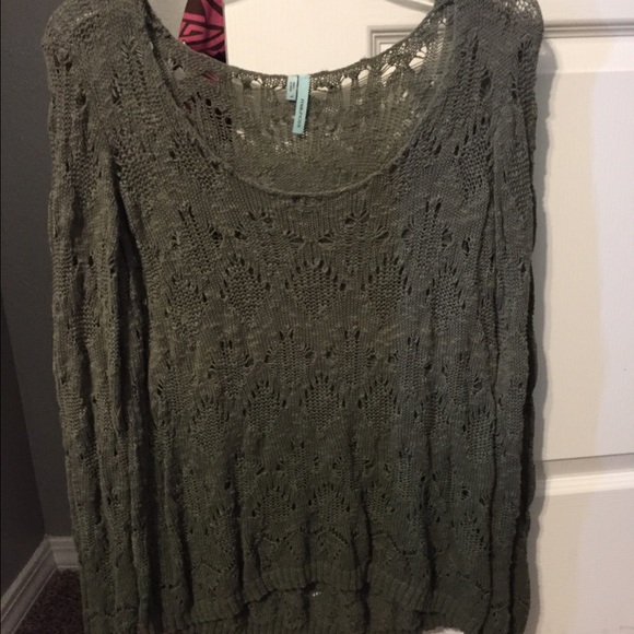 Green long sleeve sweater.