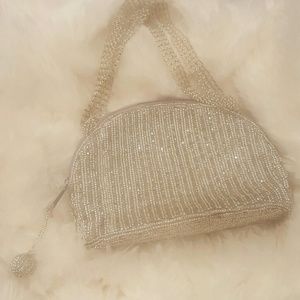 Cache silver beaded clutch