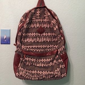 Black and white backpack with feather print