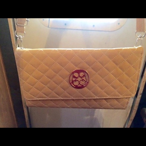 Tan purse with shoulder strap