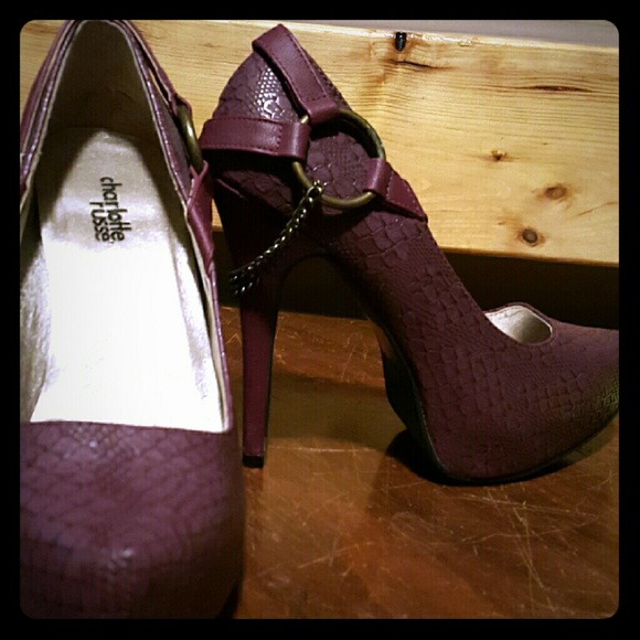 Maroon snakeskin pumps