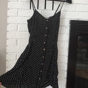 Adorable polka dot mini dress with lace up back!