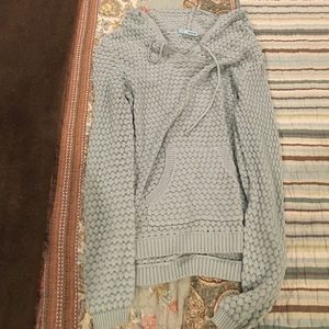 Maurice's light blue sweater