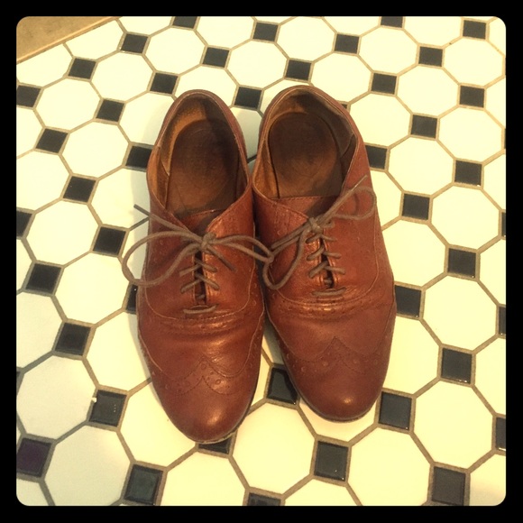 Brown lace up oxfords.