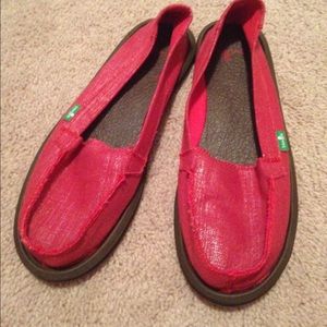 Red Sanuk slip on shoes.