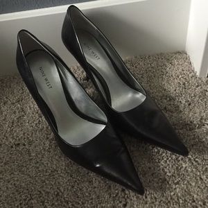 Black pointed toe pumps