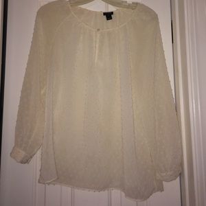 A shear white blouse from J. Crew