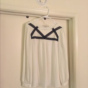 Black and white polka dot and yellow blouse.