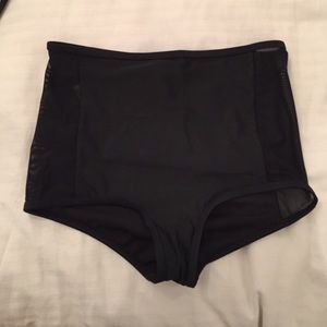 Black see through high waisted swim trunks.