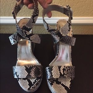 Cross ankle snake skin heels