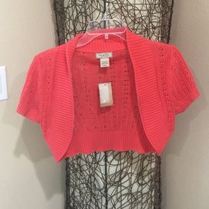 Coral colored. Never worn.