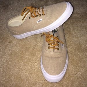 Vans with suede laces.