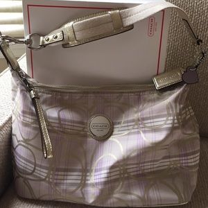 Coach satchel bag. Metallic gold leather accents