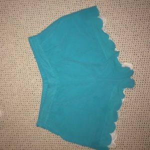 Aqua silky shorts with cream fringe on the ends