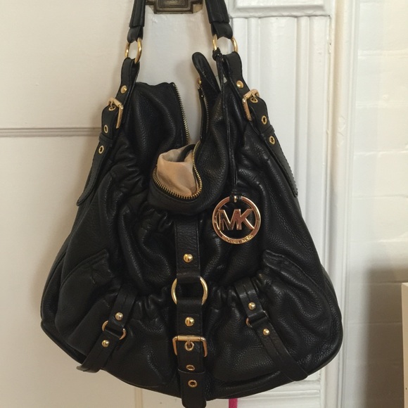 Black leather Michael Khors purse.