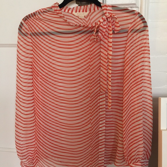 Cute professional work top. Ties at top.