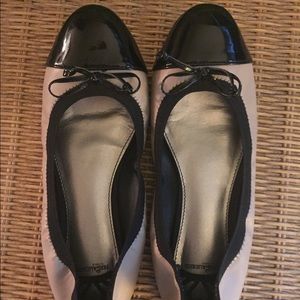 Tan and black flats.