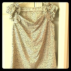 White top w/ black Polka dots and ruffle shoulders