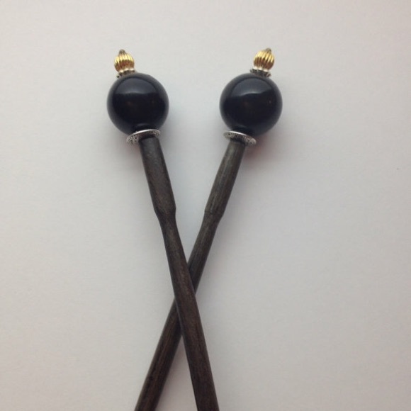 2 black ball top hair sticks