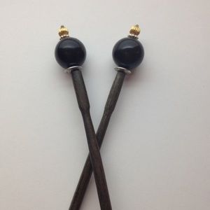 2 black ball top hair sticks